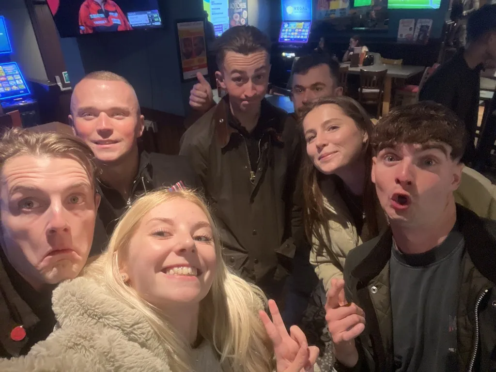 A lively group of teammates enjoying a quiz night together